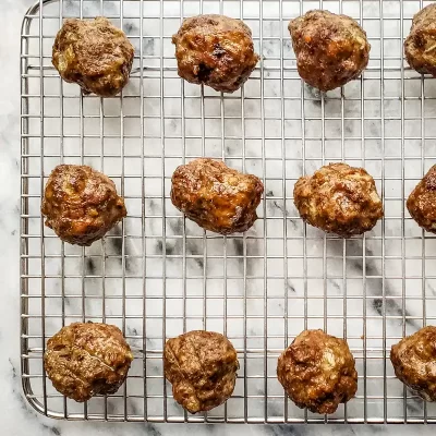 Meatballs on a wire rack.
