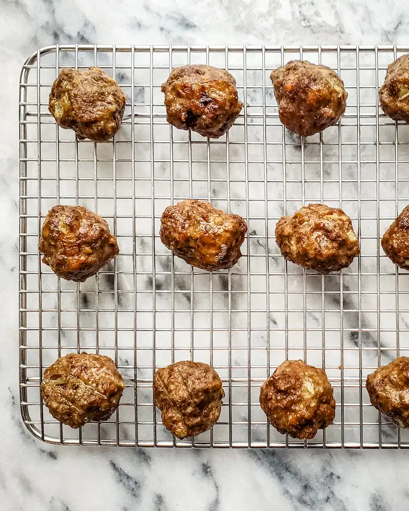 Meatballs on a wire rack.
