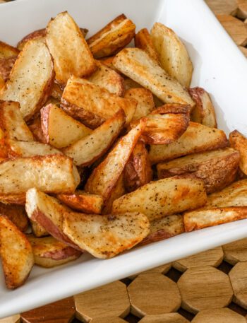 roasted potato wedges in a serving bowl