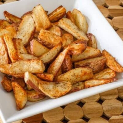 roasted potato wedges in a serving bowl
