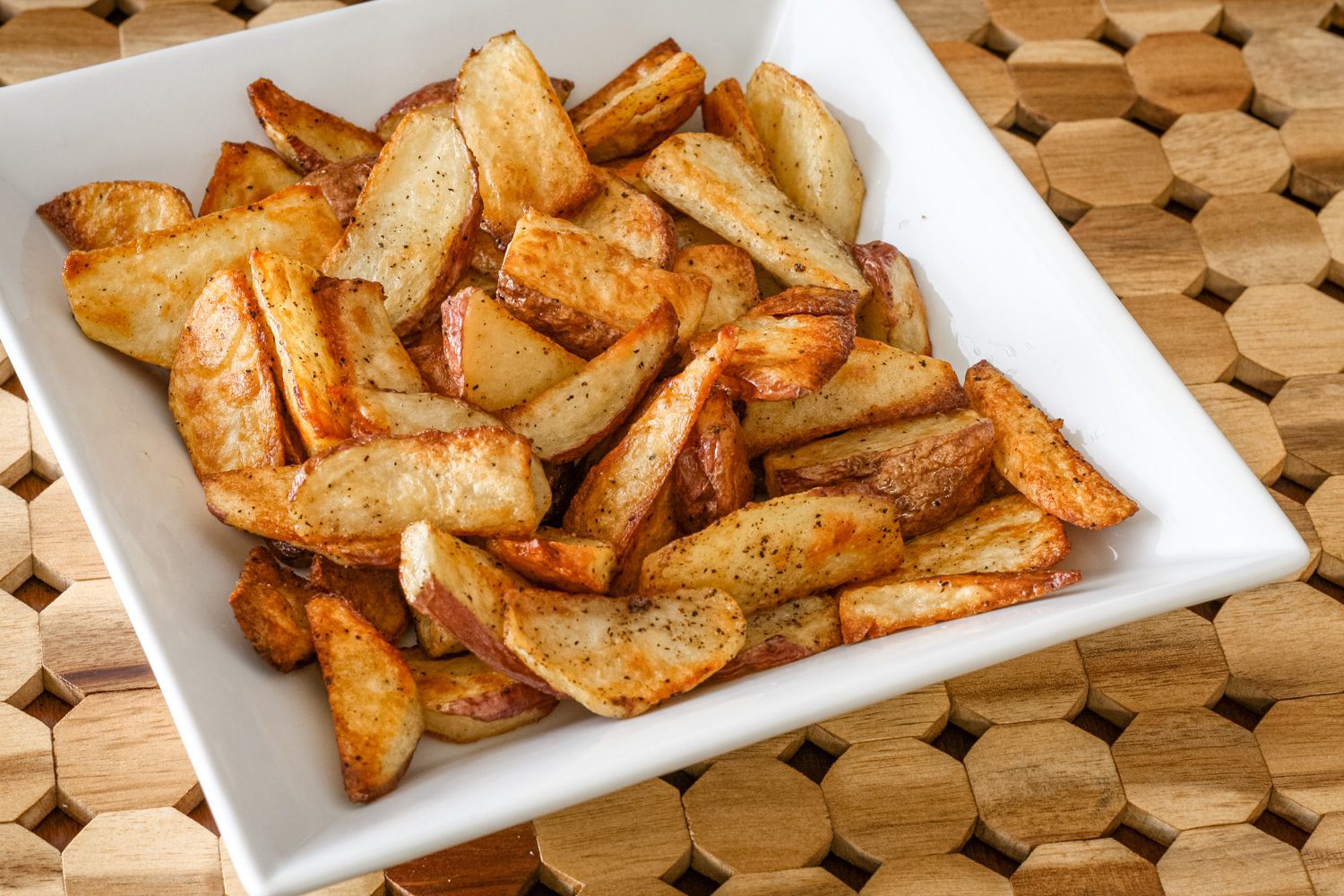 roasted potato wedges in a serving bowl