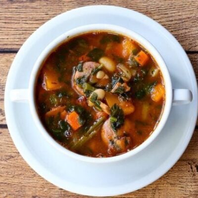 beans and sausage soup with carrots, ham, tomatoes.