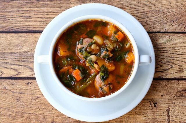 beans and sausage soup with carrots, ham, tomatoes.