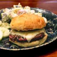 Juicy cheeseburger with melted cheese and toasted bun.