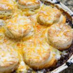 beef and bean casserole with biscuit and cheese topping