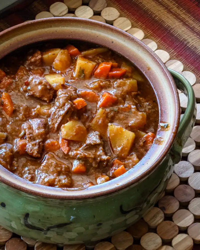 Stew with beef, potatoes, and carrots in a brown gravy.