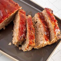A classic meatloaf sliced on a platter.