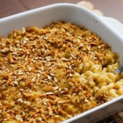 beer macaroni and cheese with a pretzel topping, in a baking dish