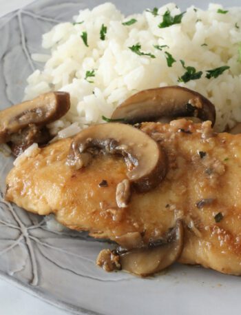 best chicken marsala with mushrooms on a plate with rice