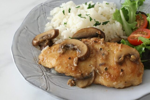 best chicken marsala with mushrooms on a plate with rice