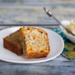 sliced moist peach bread on a plate