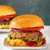 Turkey burgers with toppings and condiments.