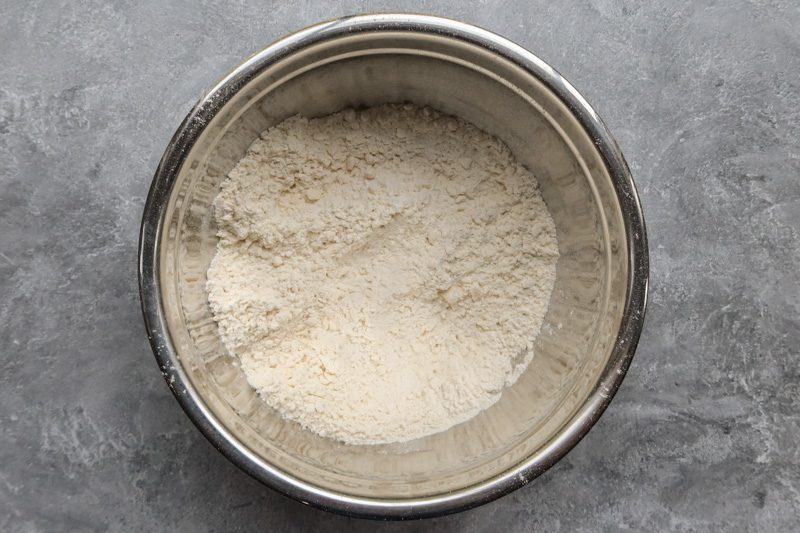 the flour and butter mixture are in a bowl to be mixed with the buttermilk.