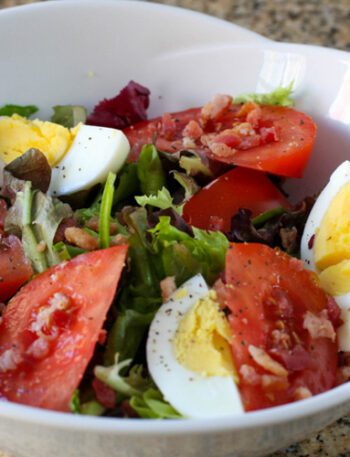 blt salad with hard boiled eggs in a serving bowl