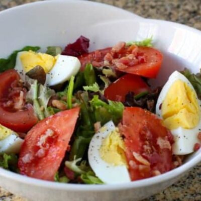 blt salad with hard boiled eggs in a serving bowl