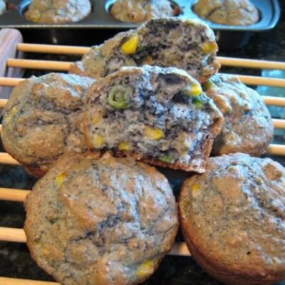 blue corn muffins on a rack