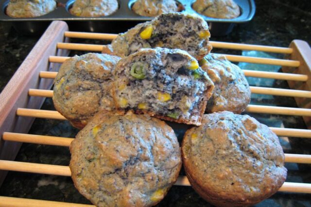 blue corn muffins on a rack