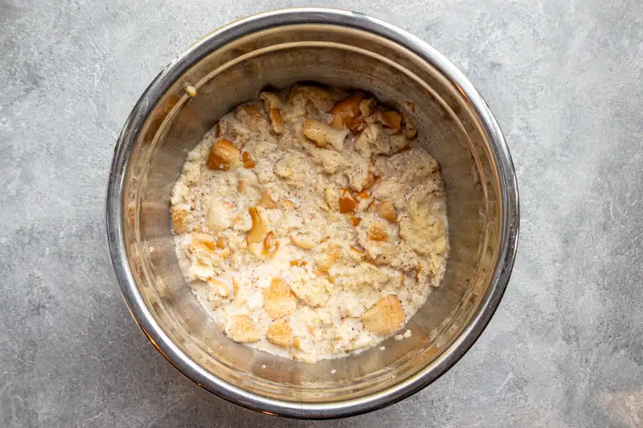 Soaking bread for blueberry bread pudding.