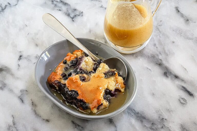 Sweet blueberry bred pudding with caramel sauce.