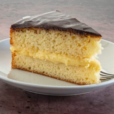 a slice of boston cream pie on a plate