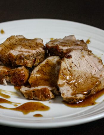 bourbon glazed pork tenderloin on a plate