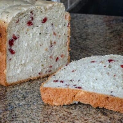bread machine cranberry bread sliced on the counter