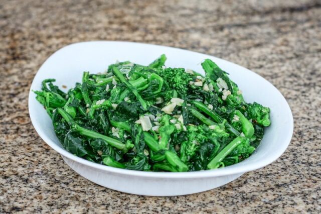 broccoli rabe with garlic in a serving dish