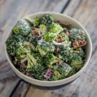 broccoli salad with sugared bacon in a large bowl