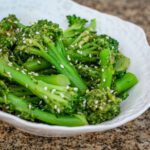 a serving bowl with sesame broccoli