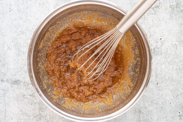 mixing the melted brown butter and sugars