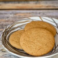 Three brown sugar cookies on a small plate, ready to eat and enjoy!