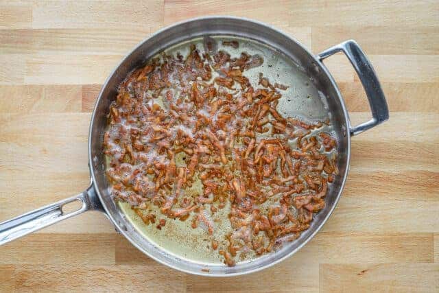 Guanciale is cooked until crisp then drained on paper towels.
