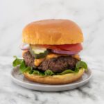 mozzarella burgers with burger sauce, tomatoes, and lettuce