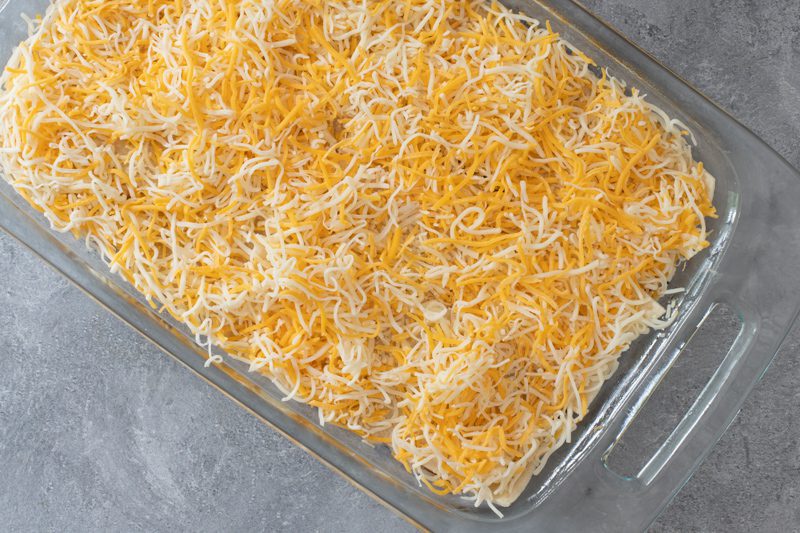 burrito casserole assembly with cheese