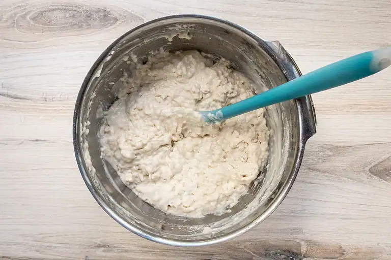 Creamy cottage cheese mixture in a stainless steel bowl.