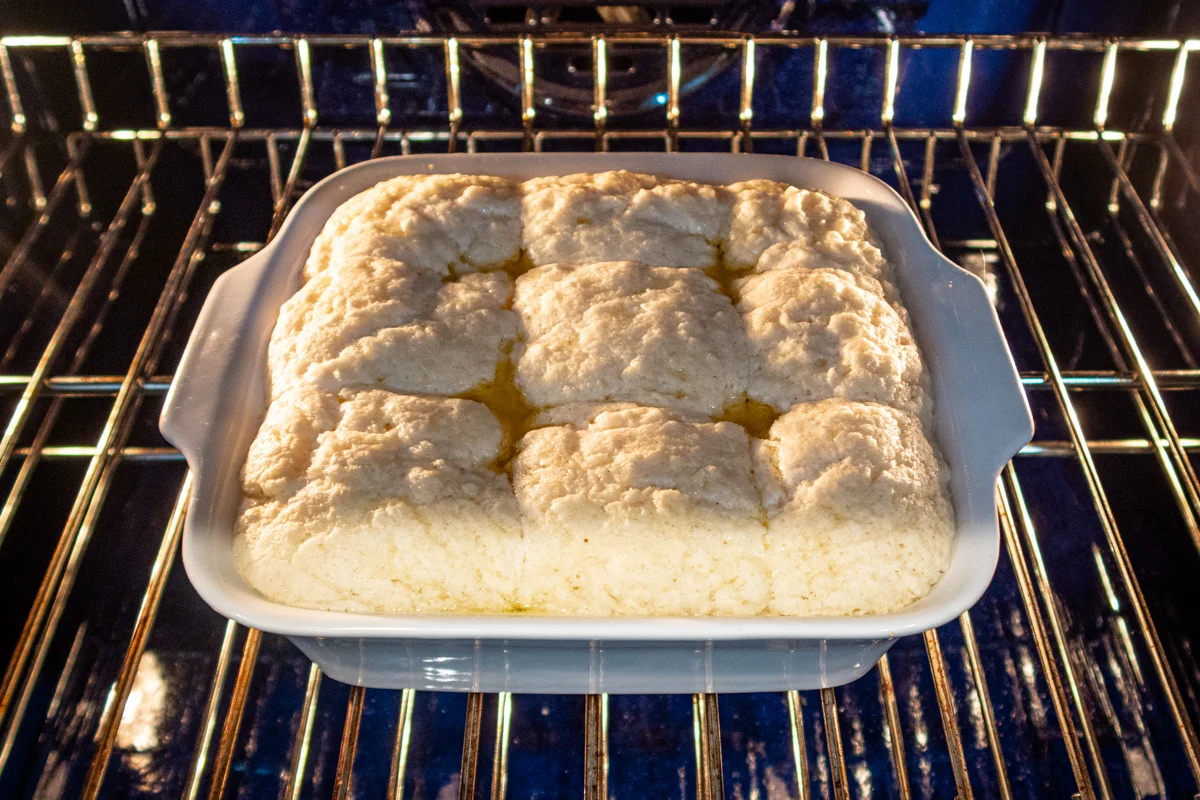 Butter swim biscuits shown baking and rising in the oven.