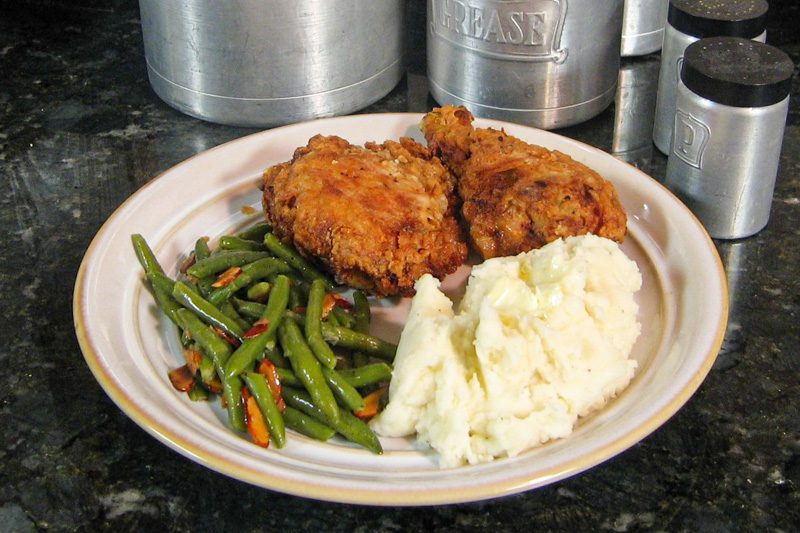 Plate with buttermilk fried chicken, mashed potatoes, and green beans
