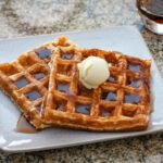buttermilk waffles with syrup and butter