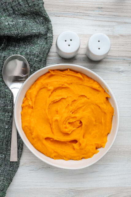 A serving bowl with mashed butternut squash.