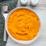 A serving bowl with mashed butternut squash.