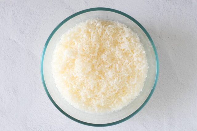 Freshly grated Pecorino Romano cheese, grated on a microplane grater