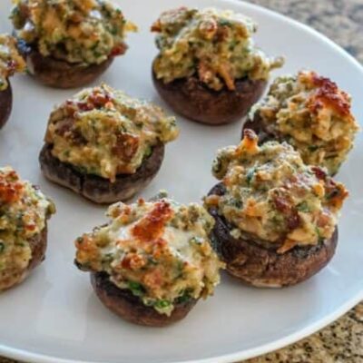 stuffed mushrooms with clams casino filling on a serving plate