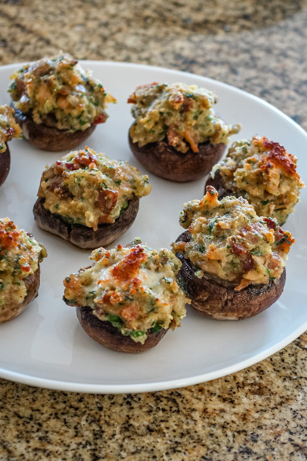 stuffed mushrooms with clams casino filling on a serving plate