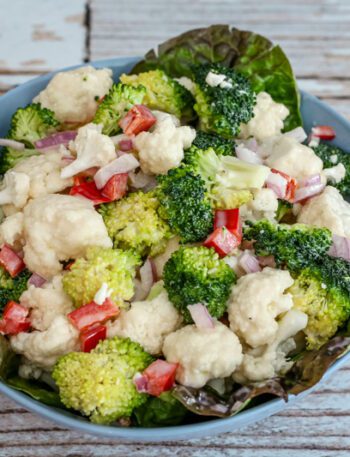 cauliflower and broccoli salad in a serving bowl
