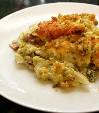 cabbage casserole with bacon and cheddar cheese on a plate