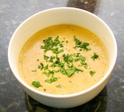 beer cheese soup with a variety of vegetables and cheddar cheese