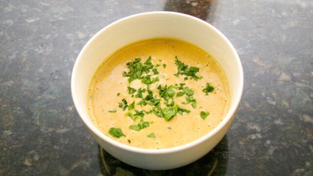 beer cheese soup with a variety of vegetables and cheddar cheese