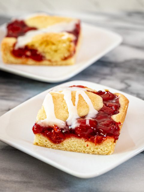 cherry cobbler bars with vanilla icing