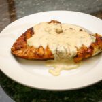 a serving of chicken breasts with dijon sauce