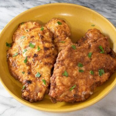 serving bowl with chicken francese